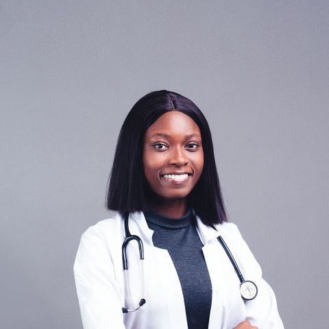 A smiling doctor in a white coat